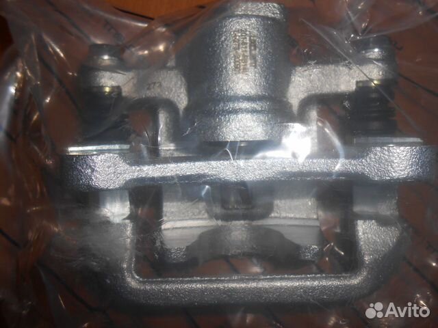 Суппорт тормозной задний правый Шевроле Лачетти