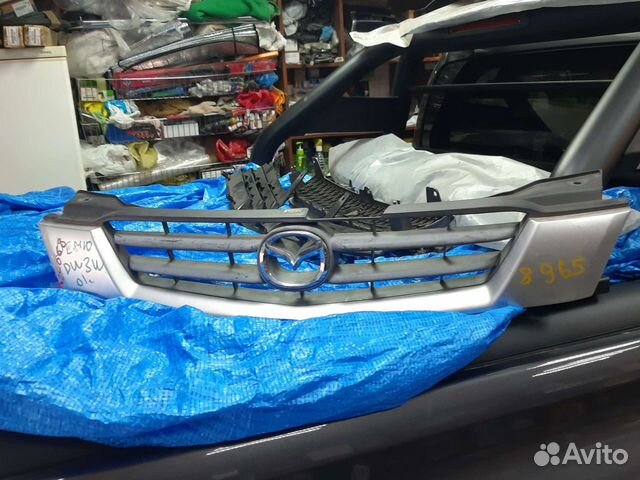 Решетка радиатора для Мазда Демио 2001 год