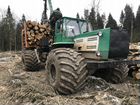 Трактор 150К для вывозки леса по болотам